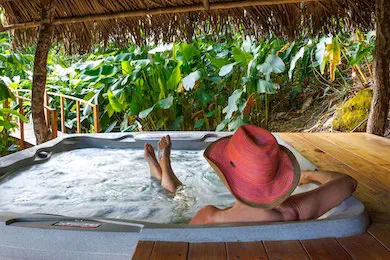 Woman enjoying Outdoor Hot Tub