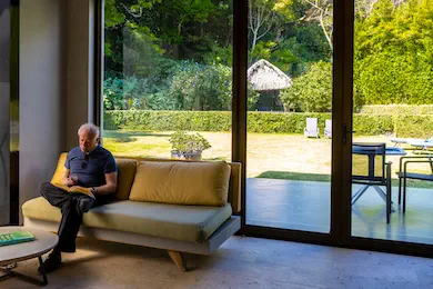 Relaxing area with Man sitting on Couch